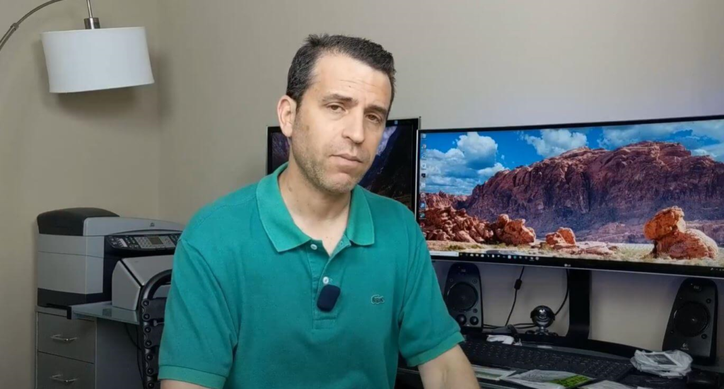 Dennis siting on his office chair